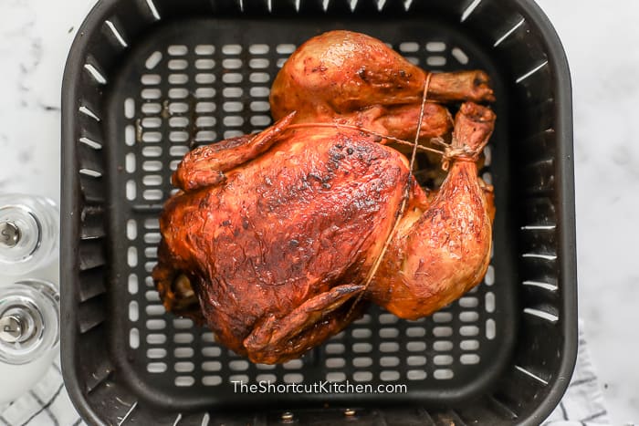 rotisserie chicken on an air fryer pan