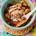 plated Chocolate Chip Cookie Mug Cake with a spoon
