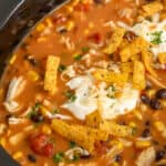 close up of crock pot chicken tortilla soup in crock pot