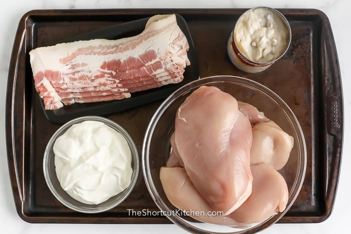 Ingredients assembled to make bacon wrapped sour cream chicken