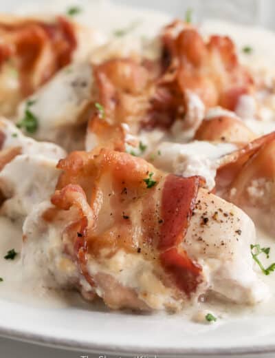 close up of bacon wrapped sour cream chicken