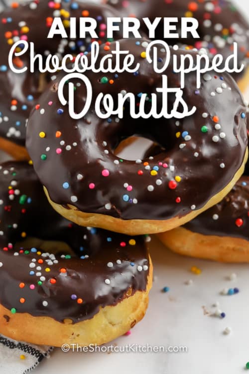 pile of chocolate dipped donuts with sprinkles with text