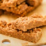 Peanut Butter Breakfast Bars in a pile on a wooden board