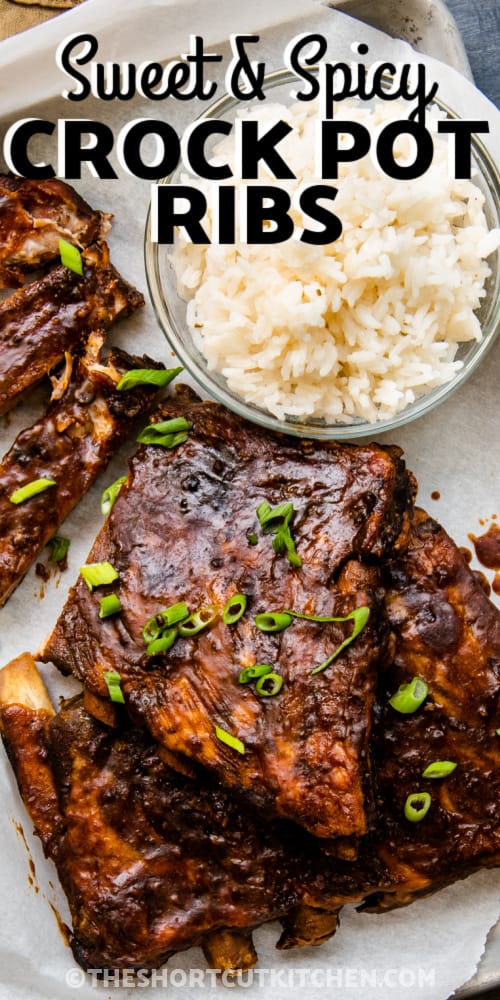 Sweet & Spicy Crock Pot Ribs garnished with green onions and a side of rice with text.