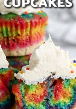 stack of rainbow coloured cupcakes with text