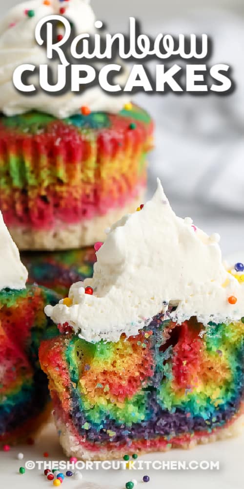 stack of rainbow coloured cupcakes with text