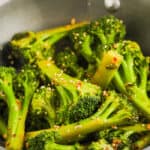 adding sauce and seasoning to Stir Fried Broccoli