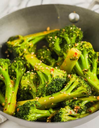 adding sauce and seasoning to Stir Fried Broccoli