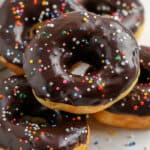 pile of chocolate dipped donuts with sprinkles