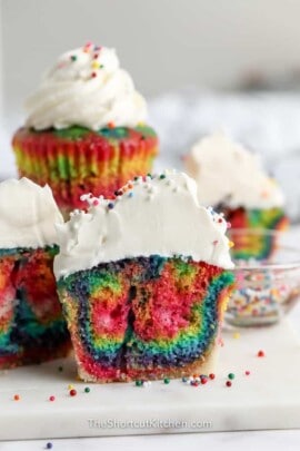 group of rainbow coloured cupcakes