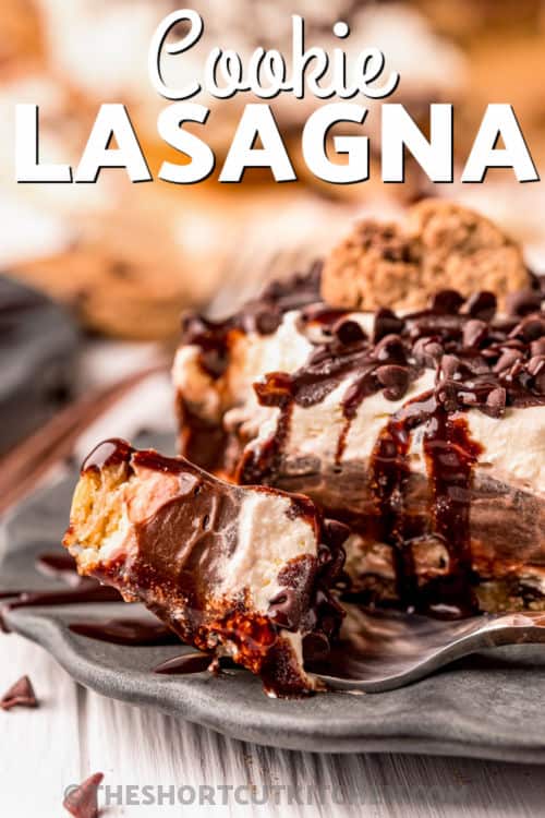 slice of Chocolate Chip Cookie Lasagna on a plate with writing