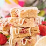 plated pile of Strawberry Shortcake Bars with a bite taken out of one