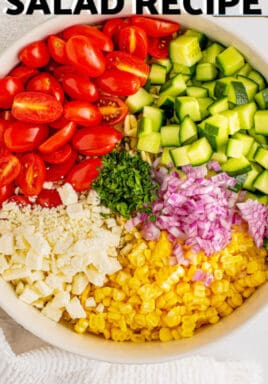 ingredients in a bowl to make an Orzo Pasta Salad with a title