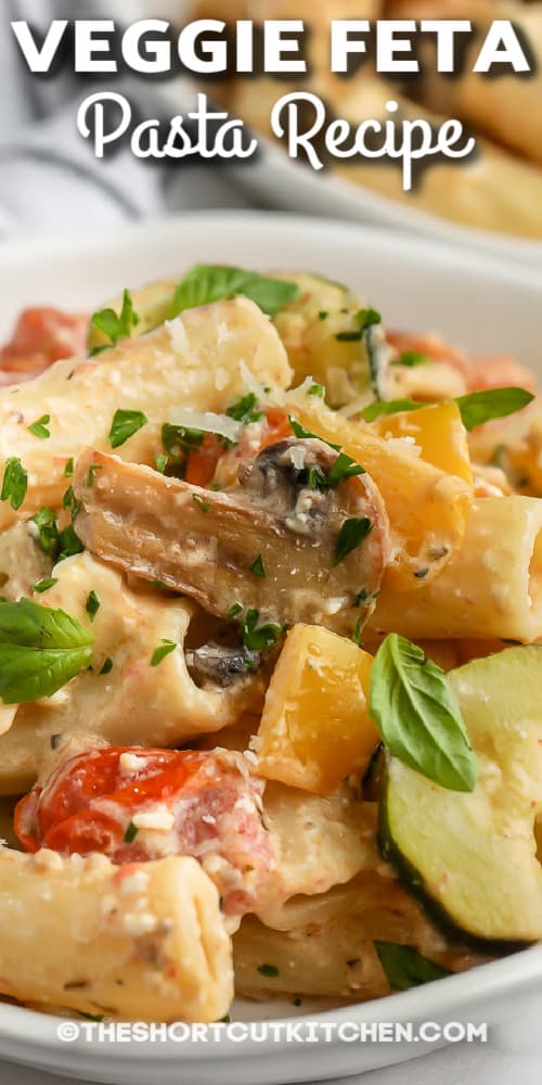 roasted vegetable feta pasta on a plate with text