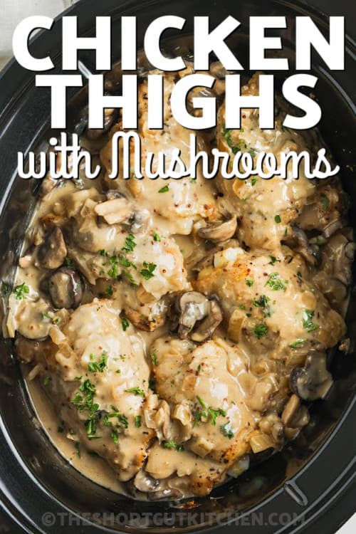 A crockpot of chicken thighs with mushrooms with writing