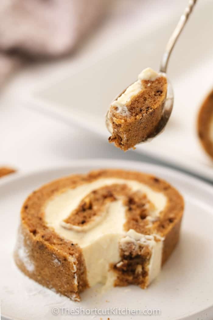 plate of Pumpkin Roll with a bite on a spoon