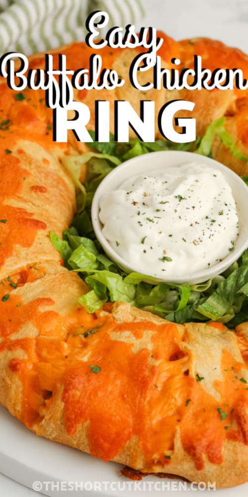 Buffalo Chicken Ring with dip in the center and writing