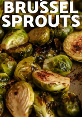 Roasted Brussel Sprouts with Balsamic Vinegar on a baking sheet with writing