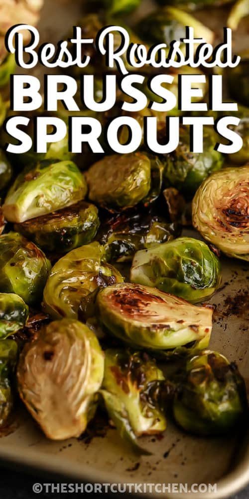 Roasted Brussel Sprouts with Balsamic Vinegar on a baking sheet with writing