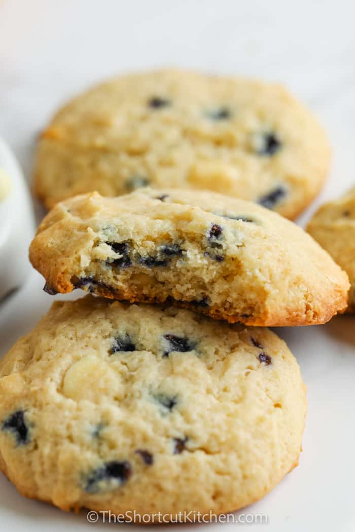 Blueberry Cheesecake Cookies with a bite out of one.