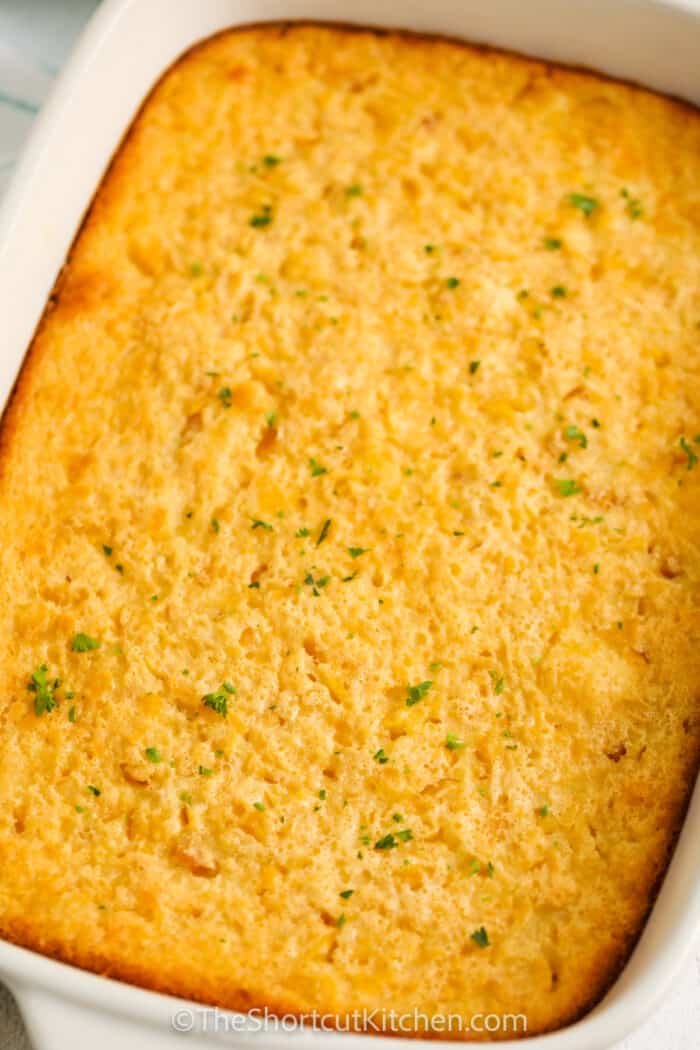 close up of Corn Pudding Casserole baked in a casserole dish