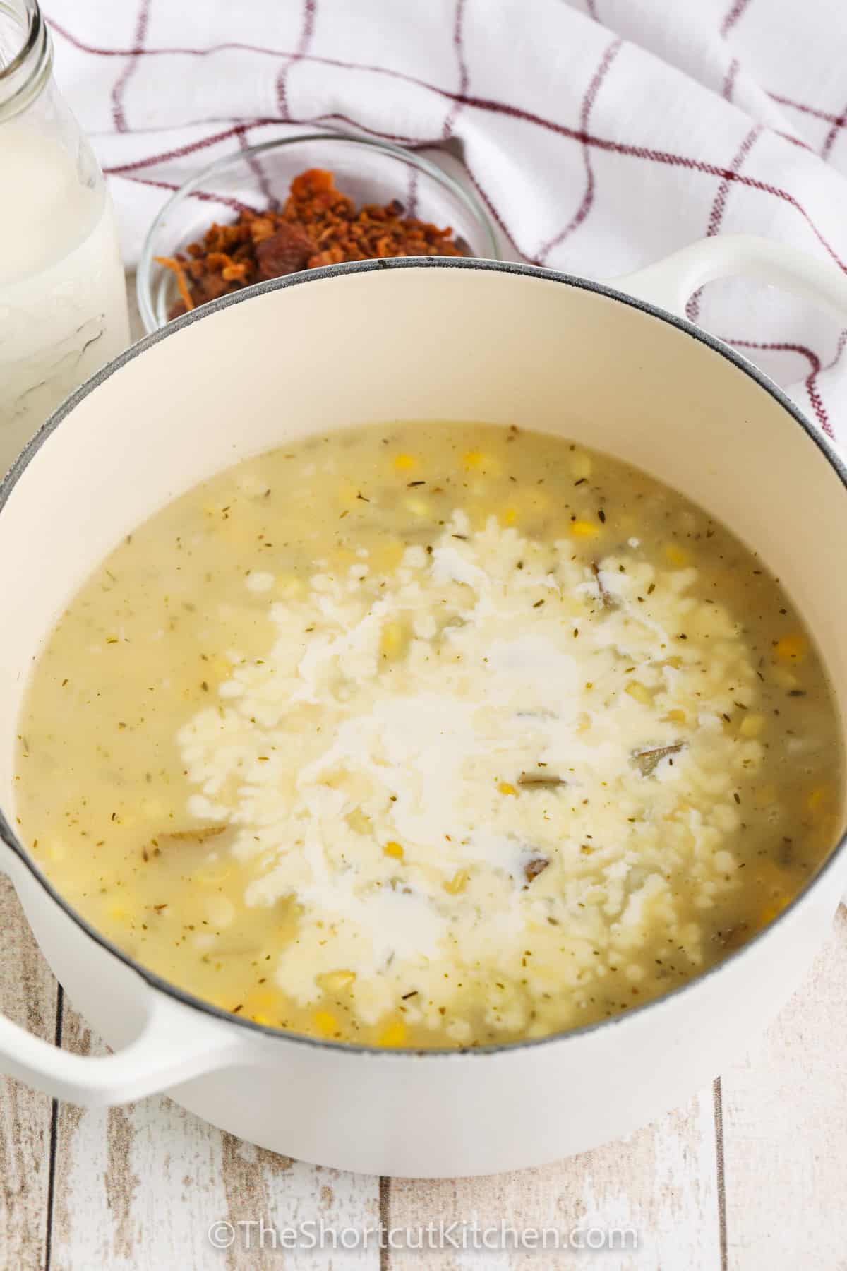 adding liquids to pot to make Easy Potato Corn Chowder