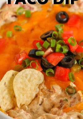 close up of Easy Taco Dip with chips and writing