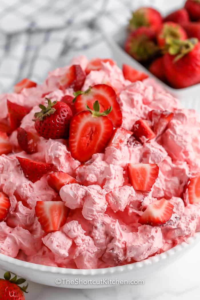 A serving dish full of strawberry fluff salad