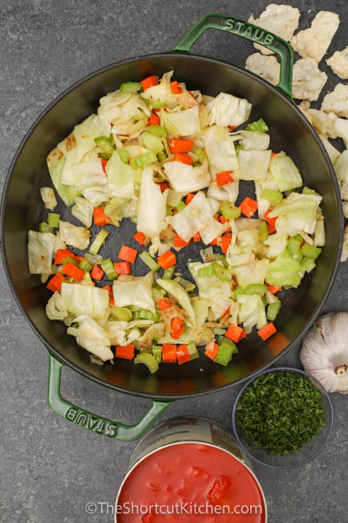 cooking vegetables to make Vegetable Soup With Cabbage