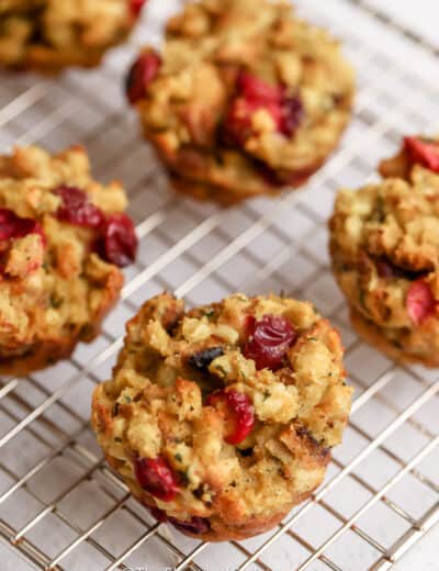 Close up of Cranberry Stuffing Muffins on a cooling rack