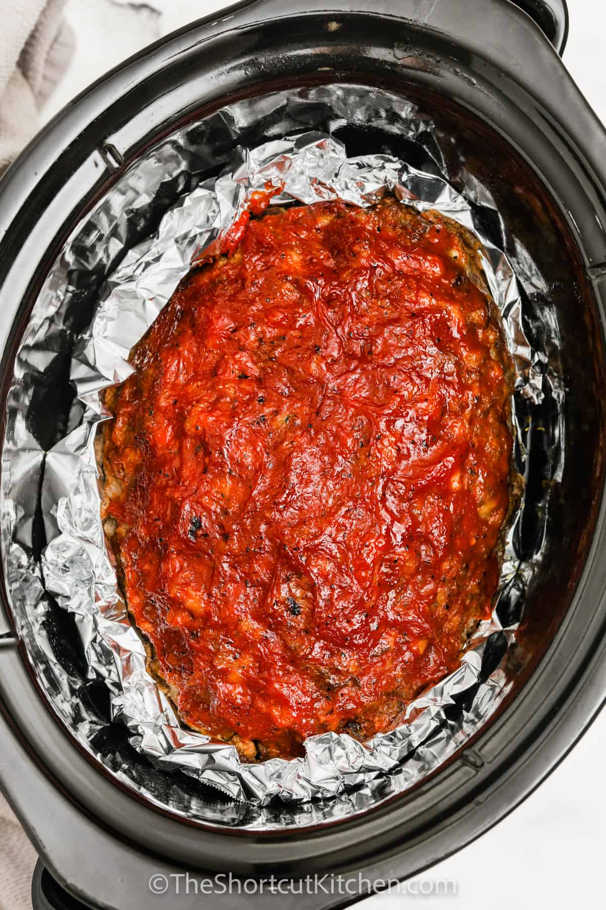 Crockpot Meatloaf in tin foil and slow cooker
