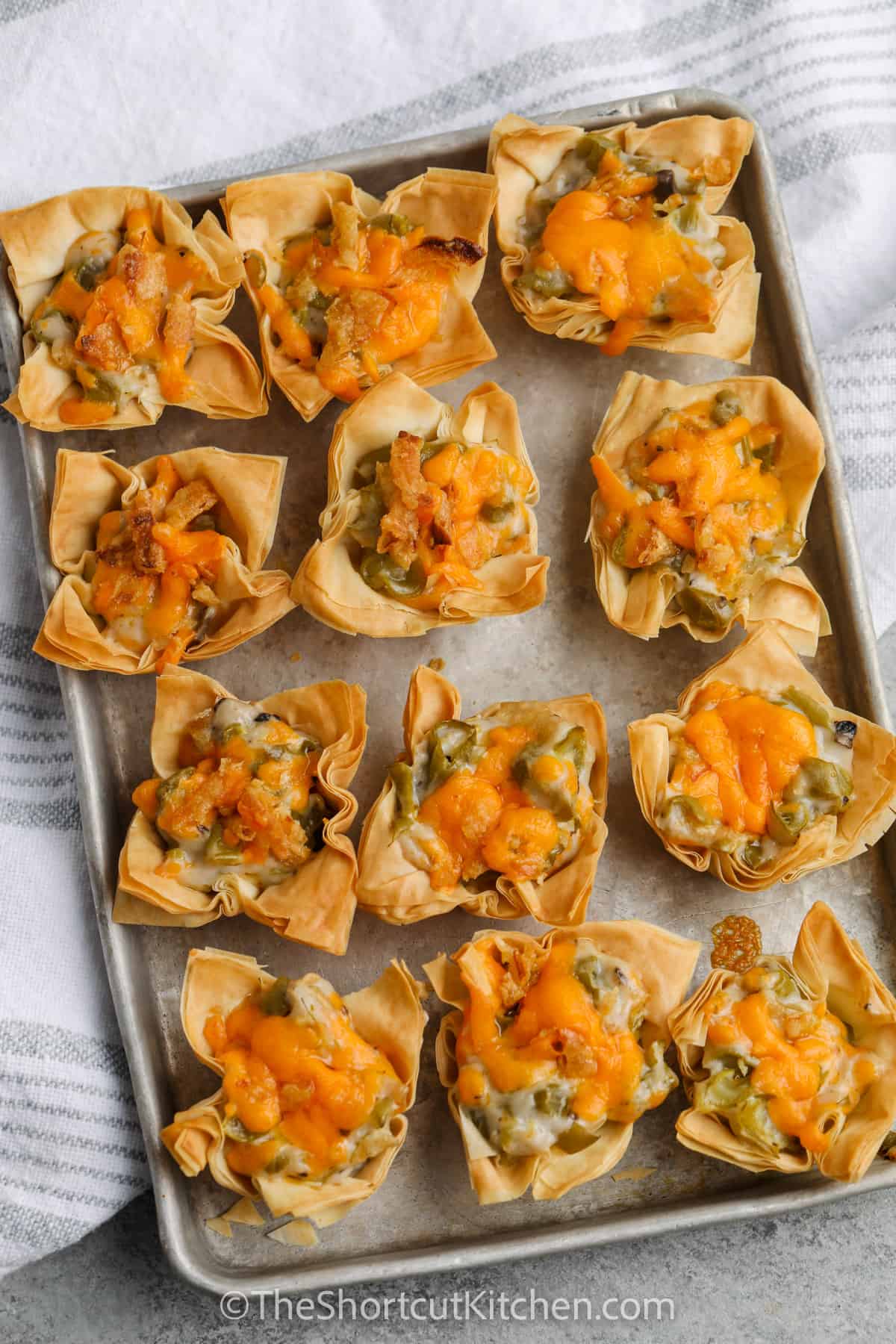 top view of cooked Green Bean Bites on a baking sheet