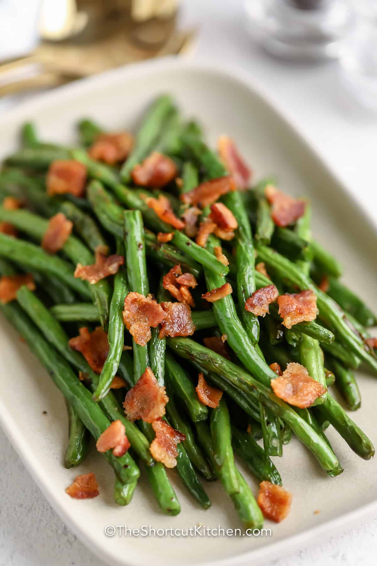 A serving tray with Air Fryer Green Beans and Bacon