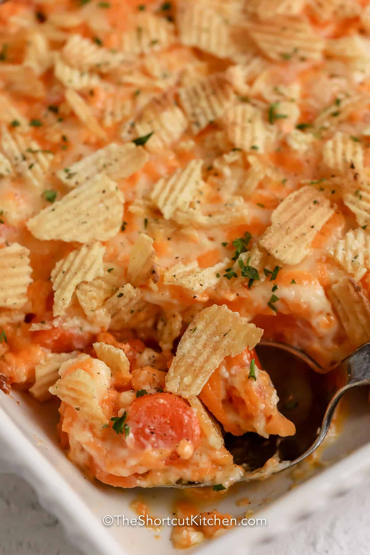 Carrot casserole being served.