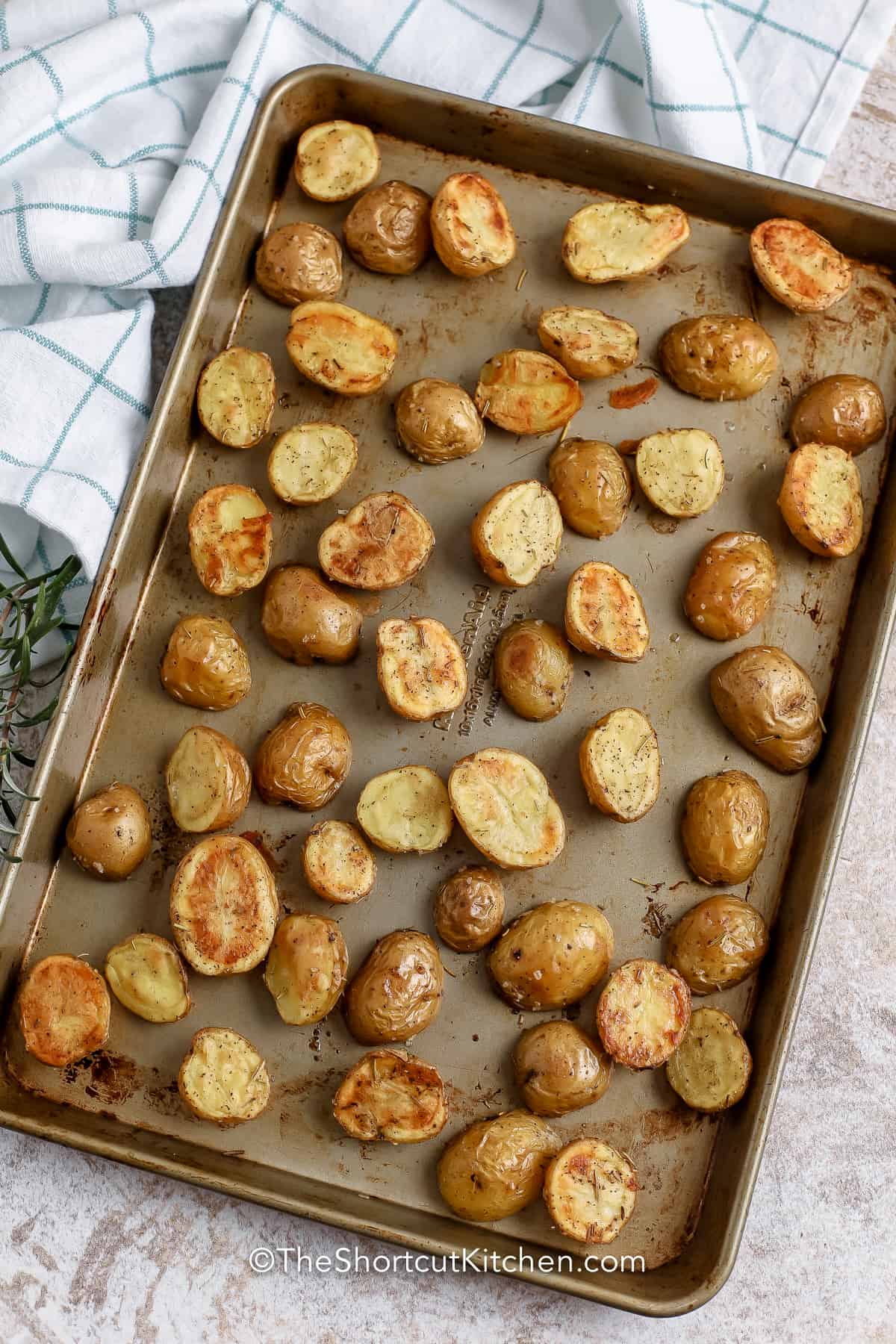 cooked Rosemary Roasted Potatoes on a baking sheet