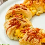 Half a Cheesy Breakfast Crescent Ring on a white plate