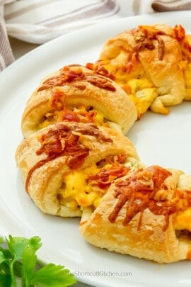 Half a Cheesy Breakfast Crescent Ring on a white plate