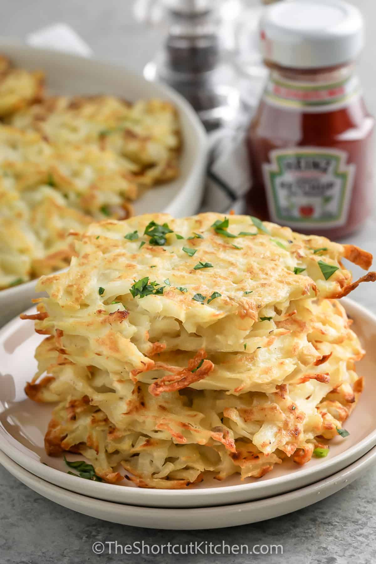 Hash Brown Patties stacked on a plate