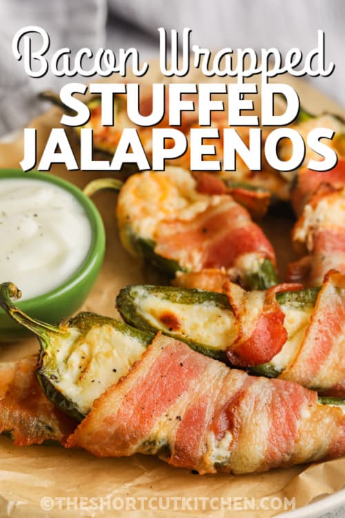 Bacon Wrapped Stuffed Jalapeno on a plate with writing