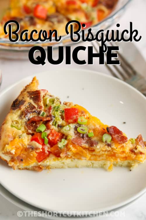 A slice of bacon quiche on a plate with writing