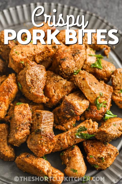 Crispy Pork Bites on a plate with writing
