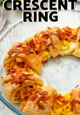 Cheesy Breakfast Crescent Ring in a pie plate with writing