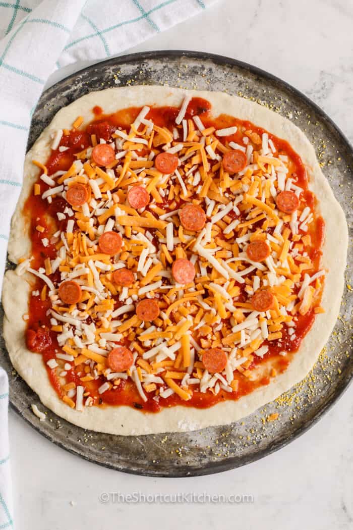 Bisquick Pizza Dough topped with pizza toppings
