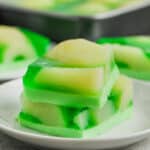 Two sliced of lime jello salad stacked