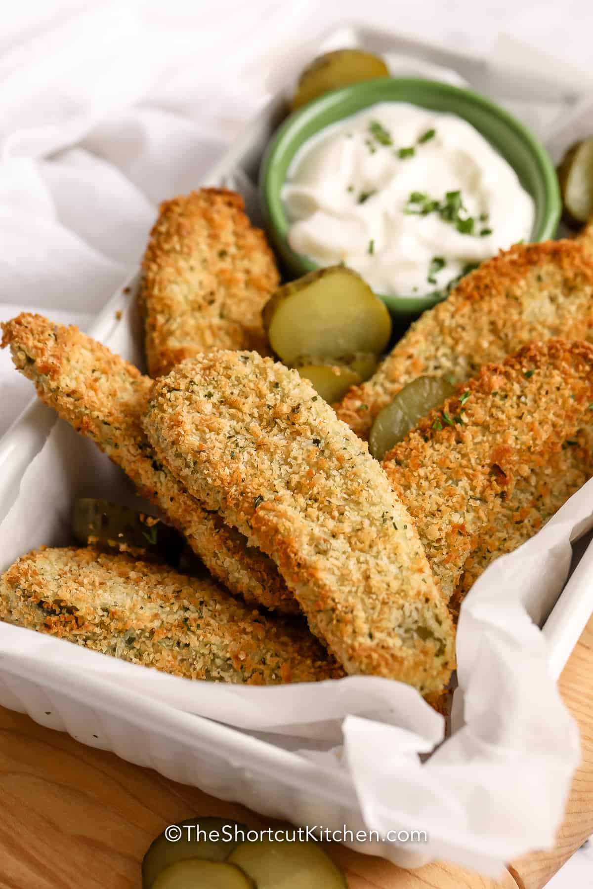 Oven Fried Pickles in a basket with dip