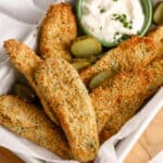 Oven Fried Pickles garnished with sliced pickles with dip