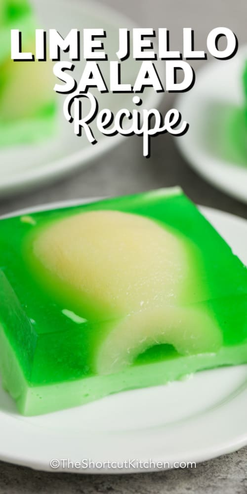 A slice of lime jello salad with writing