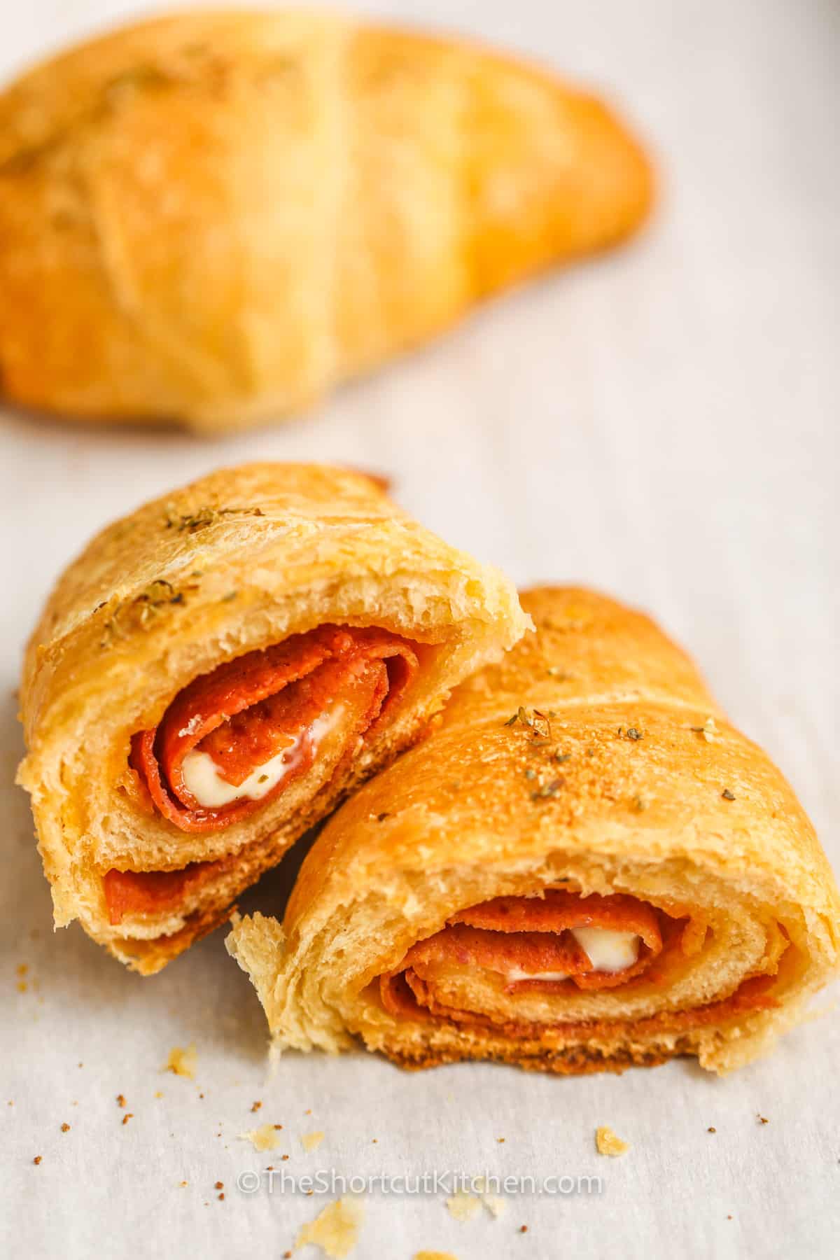 A pepperoni pizza roll sliced in half