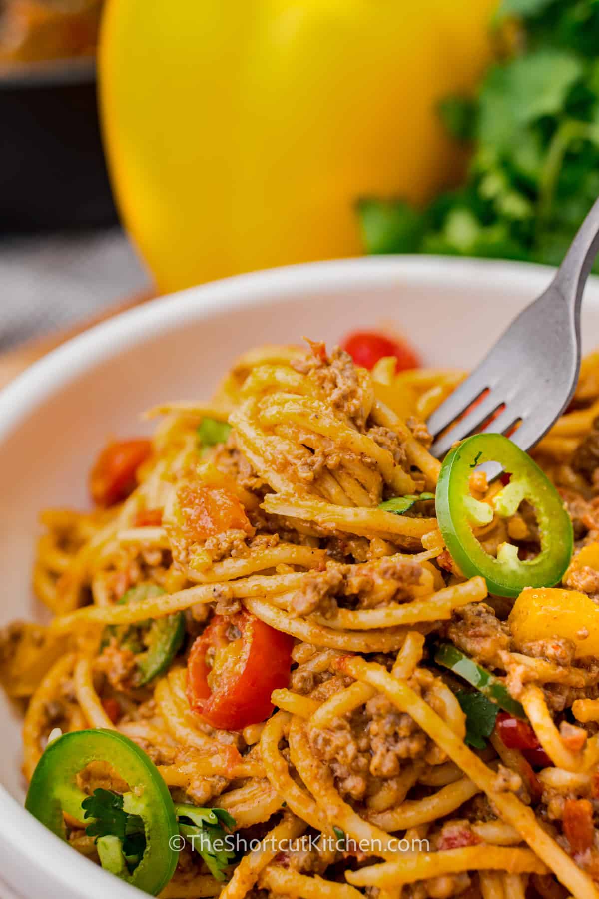 a bowl of taco spaghetti with a fork