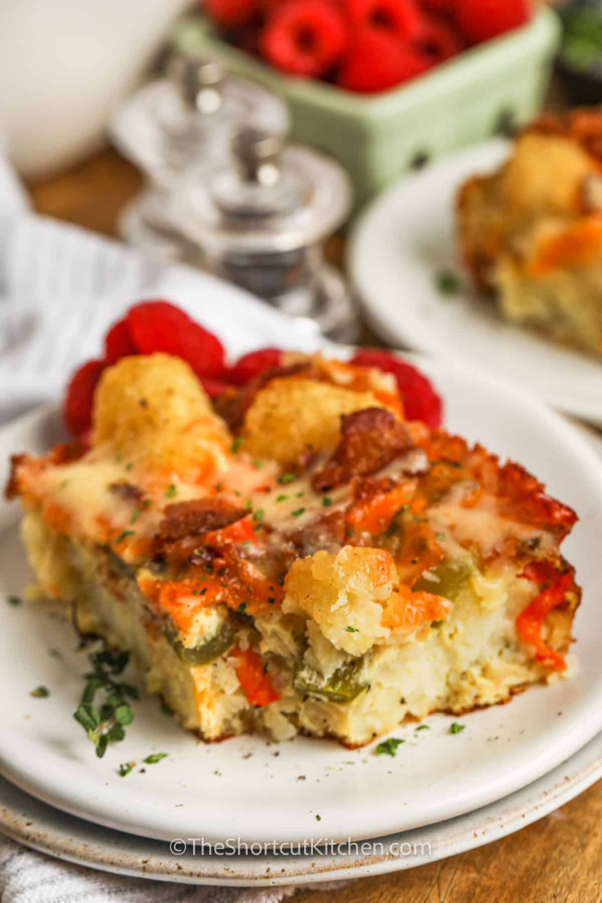 Tater Tot Breakfast Casserole on a plate with a bite taken out